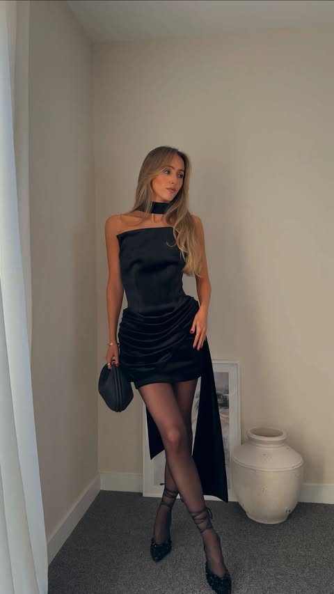 Instagram post by @oliviacharlotteburton for Nadine Merabi. Caption reads: GRWM styling the perfect elevated little black....