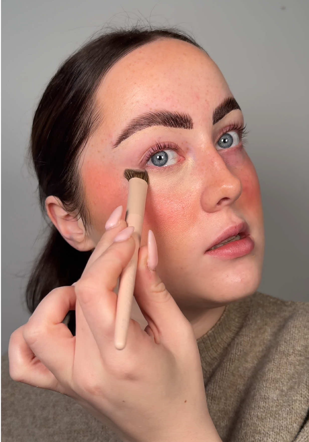 TikTok post by @errinfettermua for HNB Cosmetics. Caption reads: [...] in your makeup bag @HNB Cosmetics....