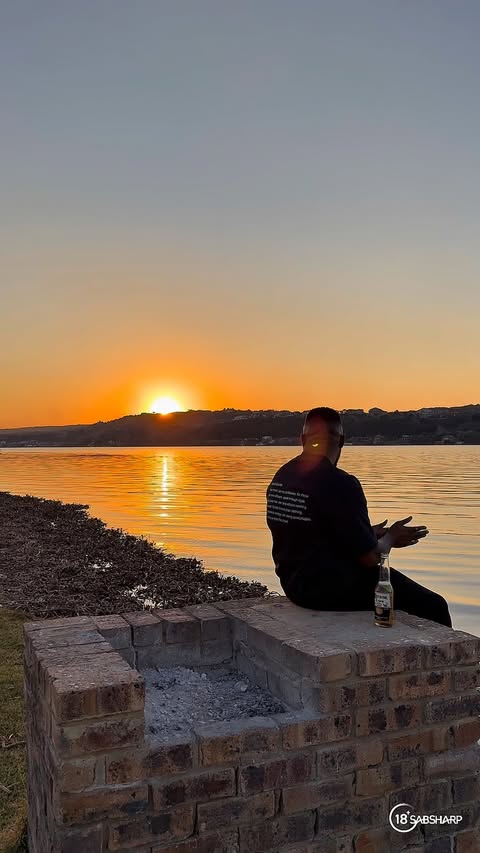 Instagram post by @thabisojoburg for Corona. Caption reads: [...] for your phone. Camping by the dam, the....