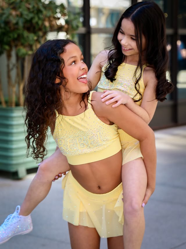 Instagram post by @aubreebedoya for Rebel Athletic. Caption reads: [...] @insta_moments_by_amber_ @coco_cheer....