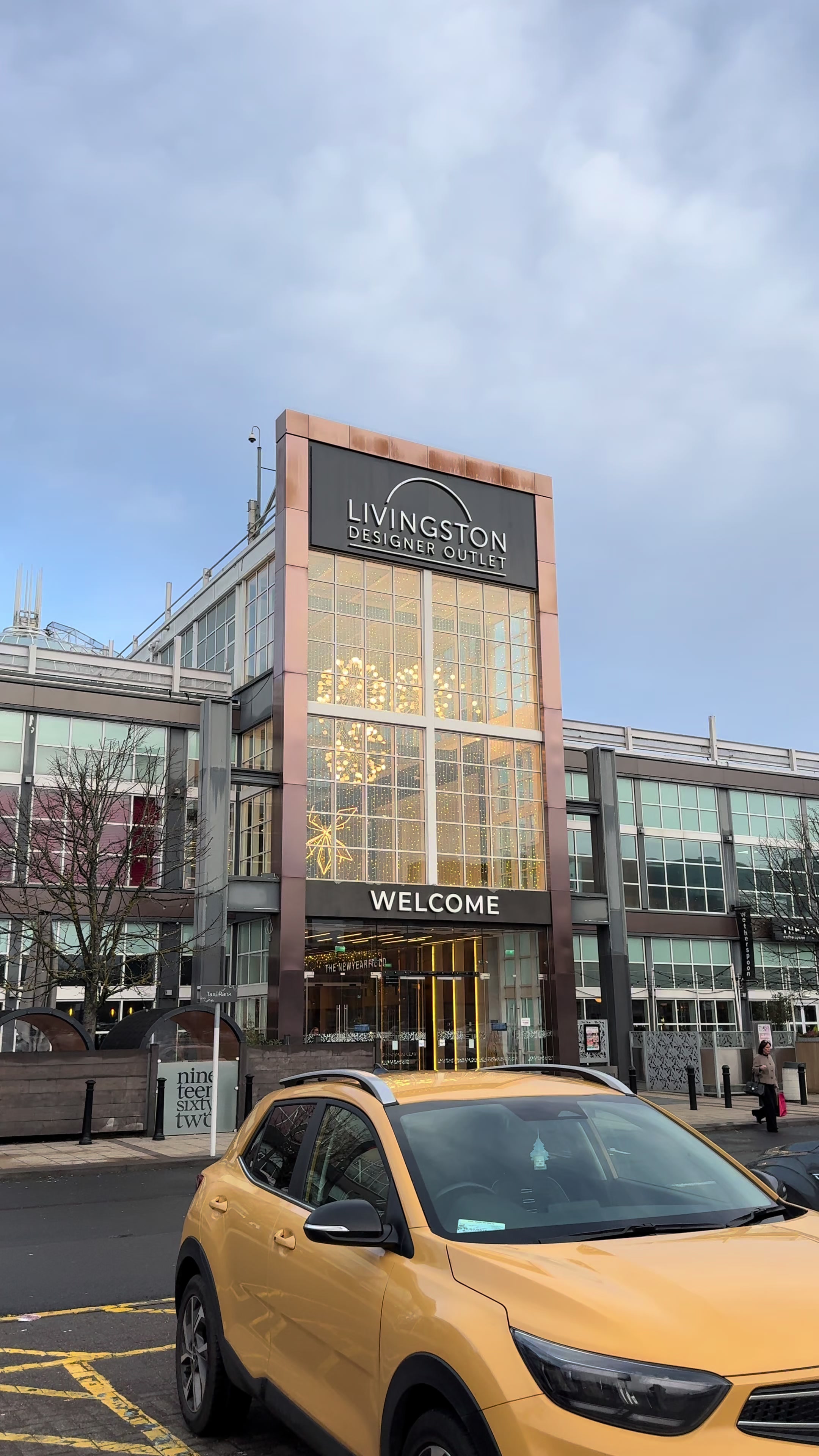 TikTok post by @leeannemcconnachie for Crocs. Caption reads: AD 📍 @livingstondesigneroutlet just got cooler 👟....