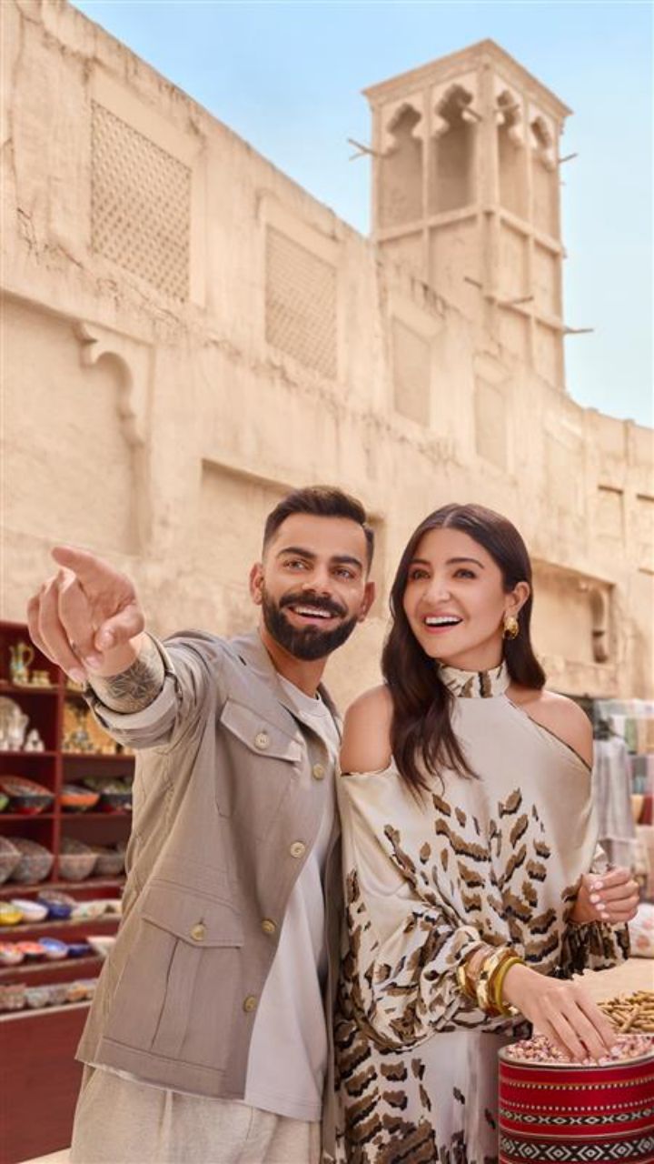 Instagram post by @virat.kohli for Visit Dubai. Caption reads: From quaint bonfires to spontaneous moments by the....