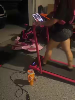 TikTok post by @kinkywinksandco for Yagudfitness. Caption reads: Pink walking pad from @Yagud pink weighted vest....