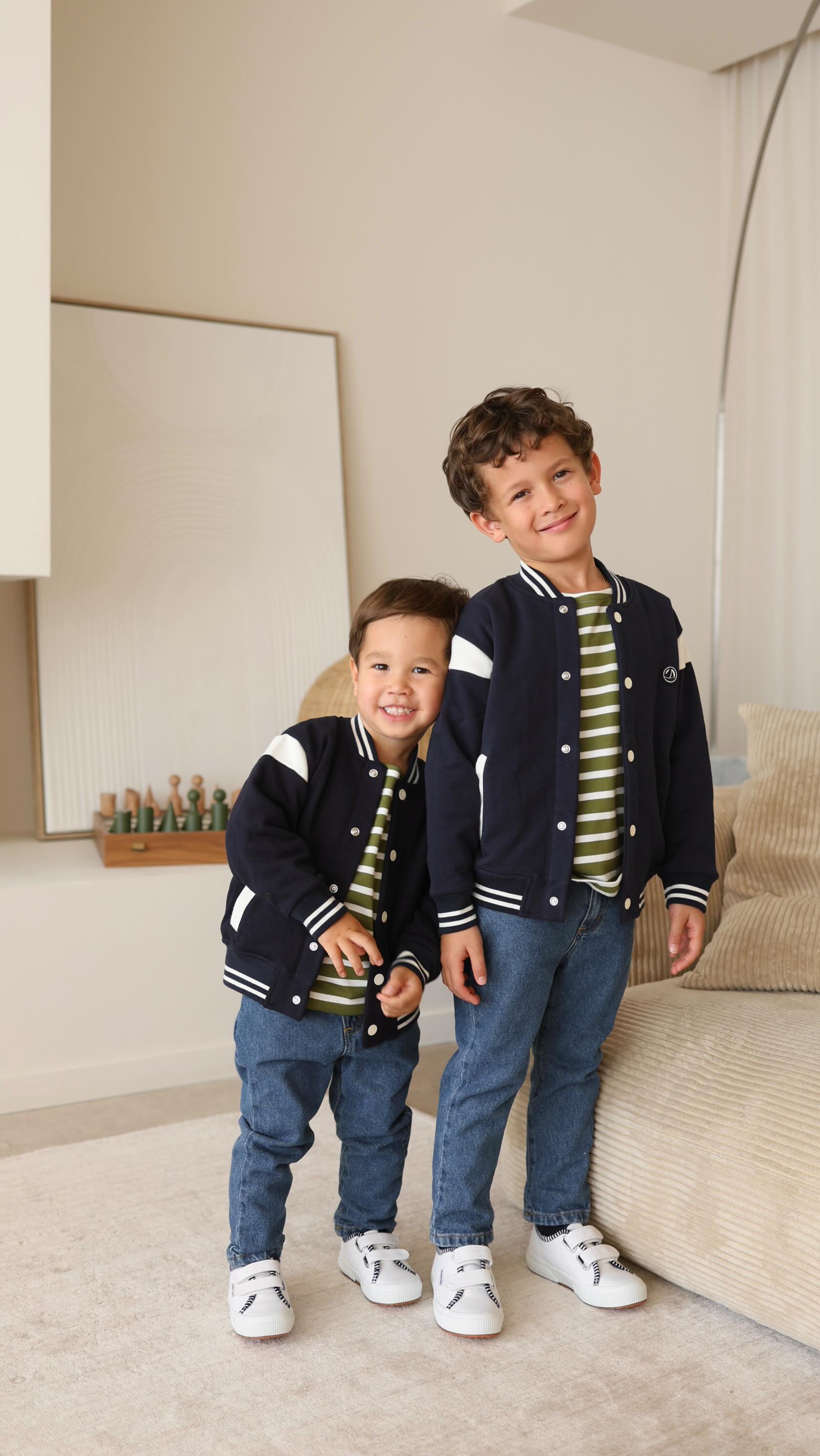 Instagram post by @thebabooshka for Petit Bateau. Caption reads: Votez pour votre look de rentrée préféré Petit....