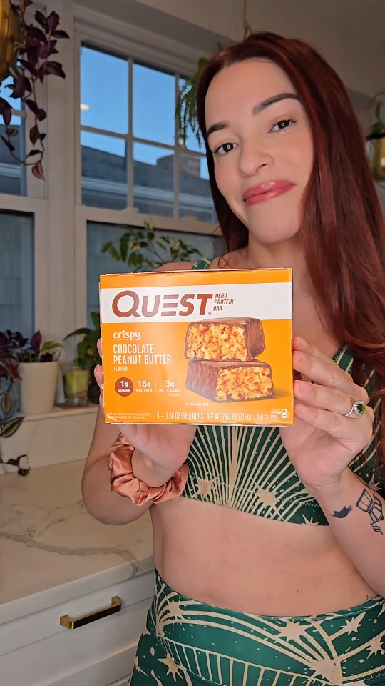 Instagram post by @kittyj08 for Quest Nutrition. Caption reads: It's my Resolution Revolution here is my cheat....