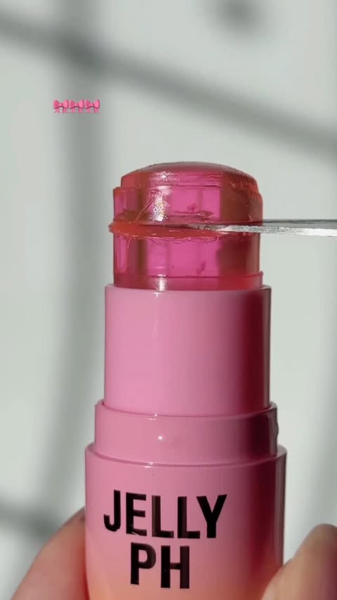 Instagram post by @fromsandyxo for Makeup Revolution. Caption reads: Cute 🎀 @makeuprevolution Jelly Glow PH Lip &....