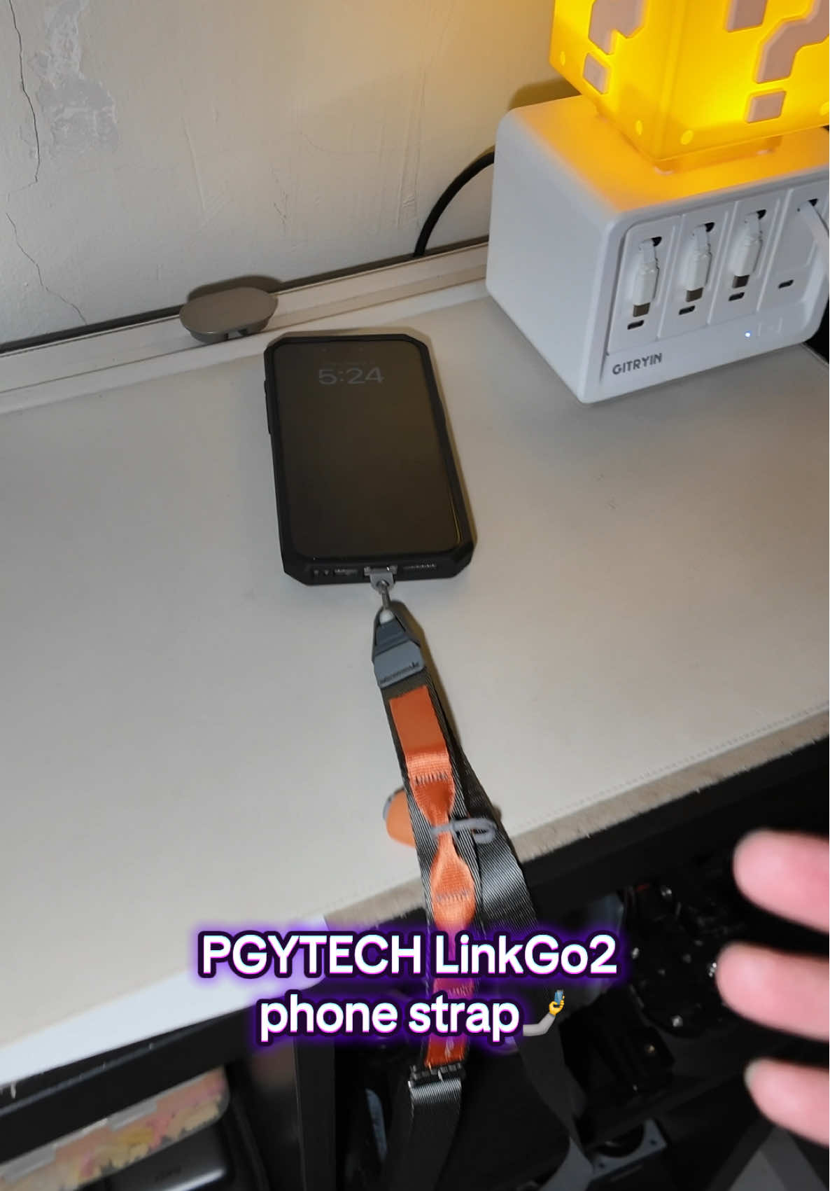 TikTok post by @theonetechguy for PGYTECH. Caption reads: PGYTECH LinkGo2 phone strap @PGYTECH [...].