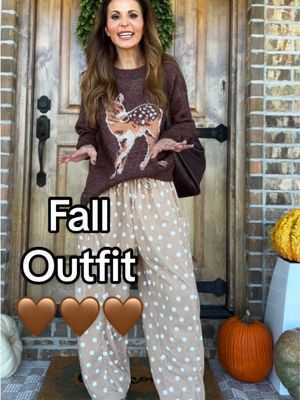 TikTok post by @enjohnson for UEU. Caption reads: Fall outfits make me happy 🤎🍂 @UEU @stevemadden....