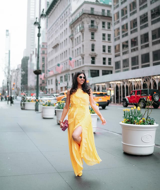 Instagram post by @jagriti.dwivedi_ for JardinVue. Caption reads: [...] the light, NYC brings the drama 💛🗽....