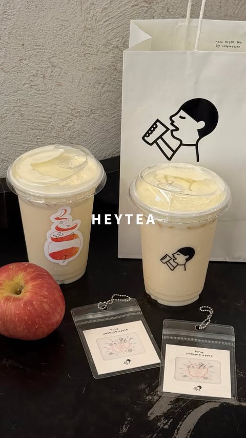 Instagram post by @ice_dwhite for HEYTEA. Caption reads: [NEW‼️] heytea launches new King Jasmine Apple 🍎✨....