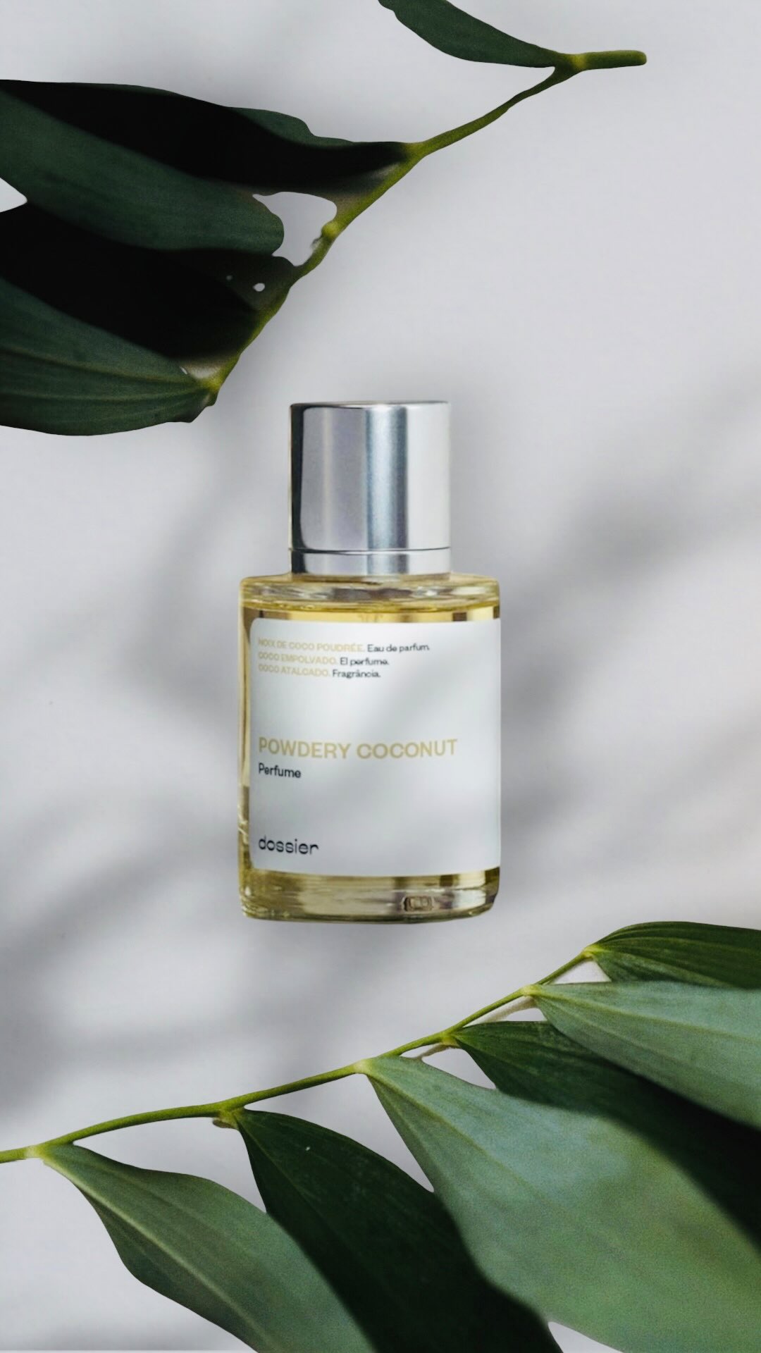 Instagram post by @glowdaily__ for Dossier. Caption reads: 🥥 Luxury perfumes without the expensive tags!....