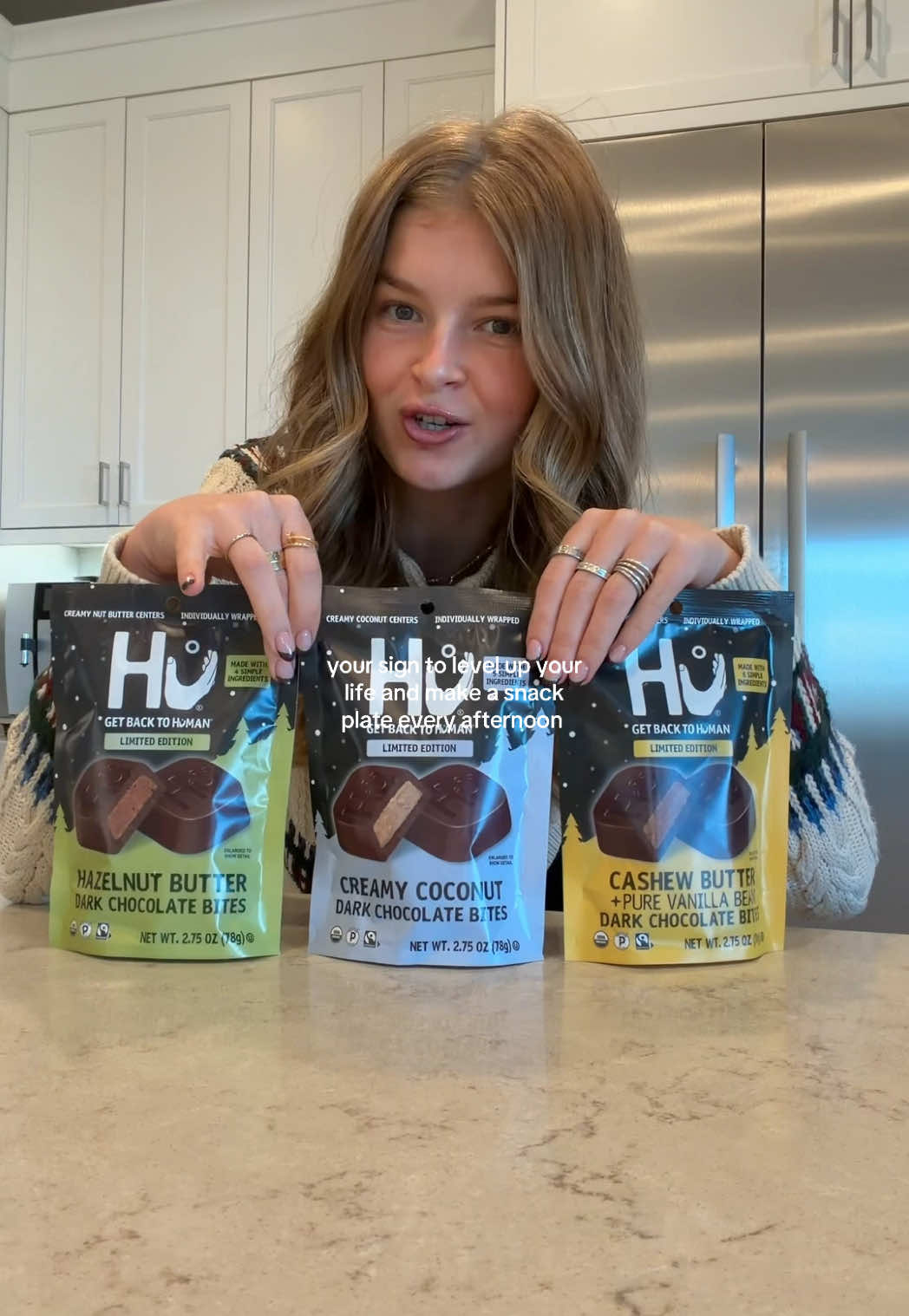 TikTok post by @allieappleton for Hu Kitchen. Caption reads: holiday snack plate🎁🍫❄️ with the @hukitchen dark....