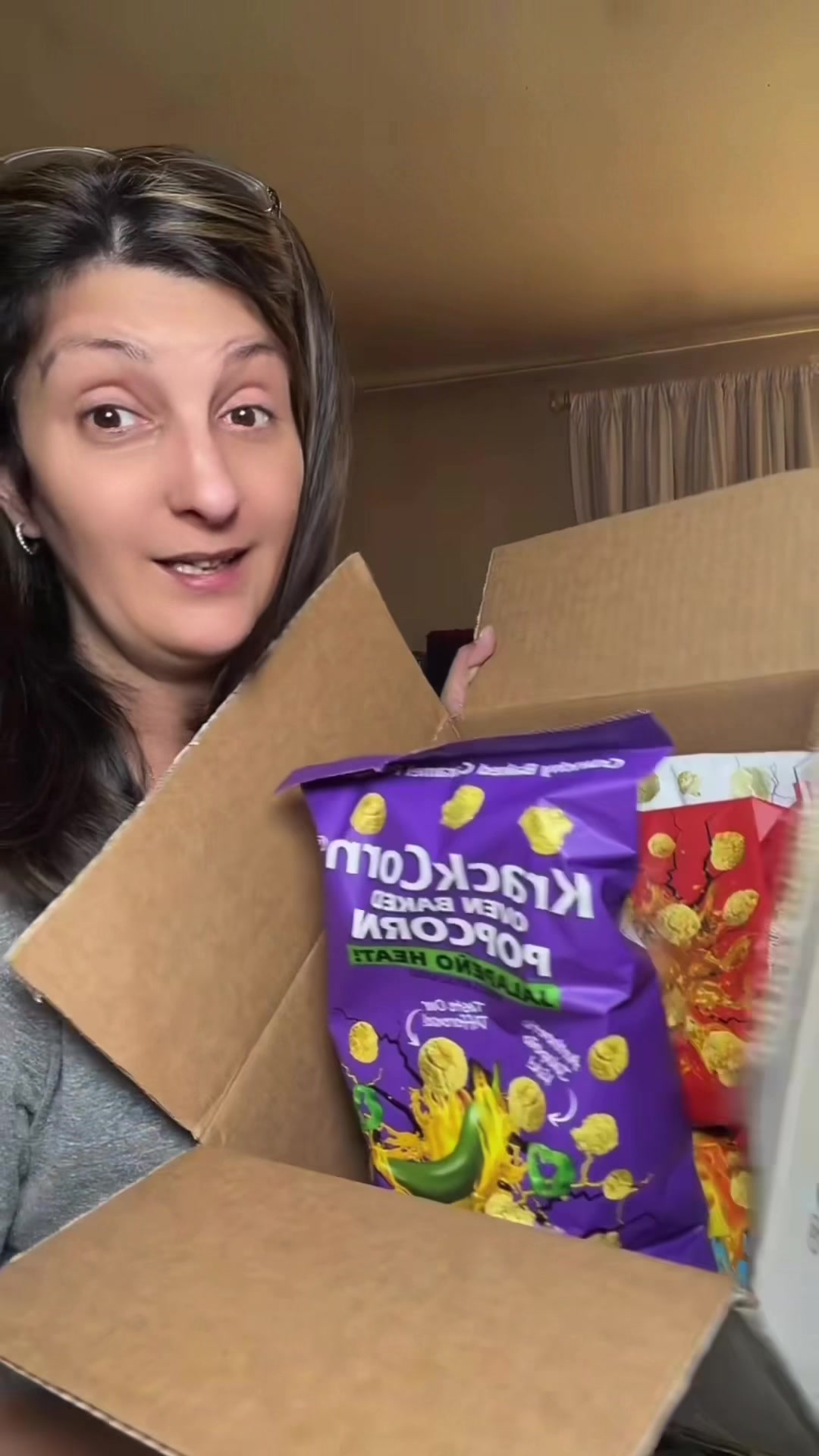 TikTok post by @bellarosepearl for KrackCorn Popcorn. Caption reads: I love this popcorn from @KrackCorn Popcorn....