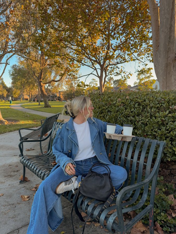 Instagram post by @meredithsophiaa for HOBO. Caption reads: My fall uniform 🍁🍂 My go-to purse from....