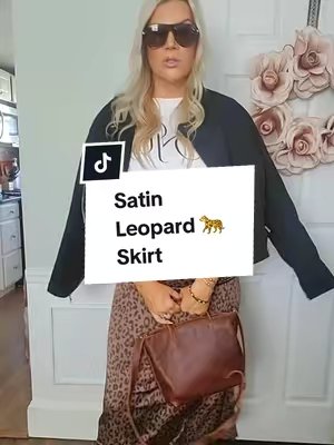 TikTok post by @ejlovesboston for luvamia. Caption reads: [...] makes it so easy to wear! 🐆🤎 This Luvamia....