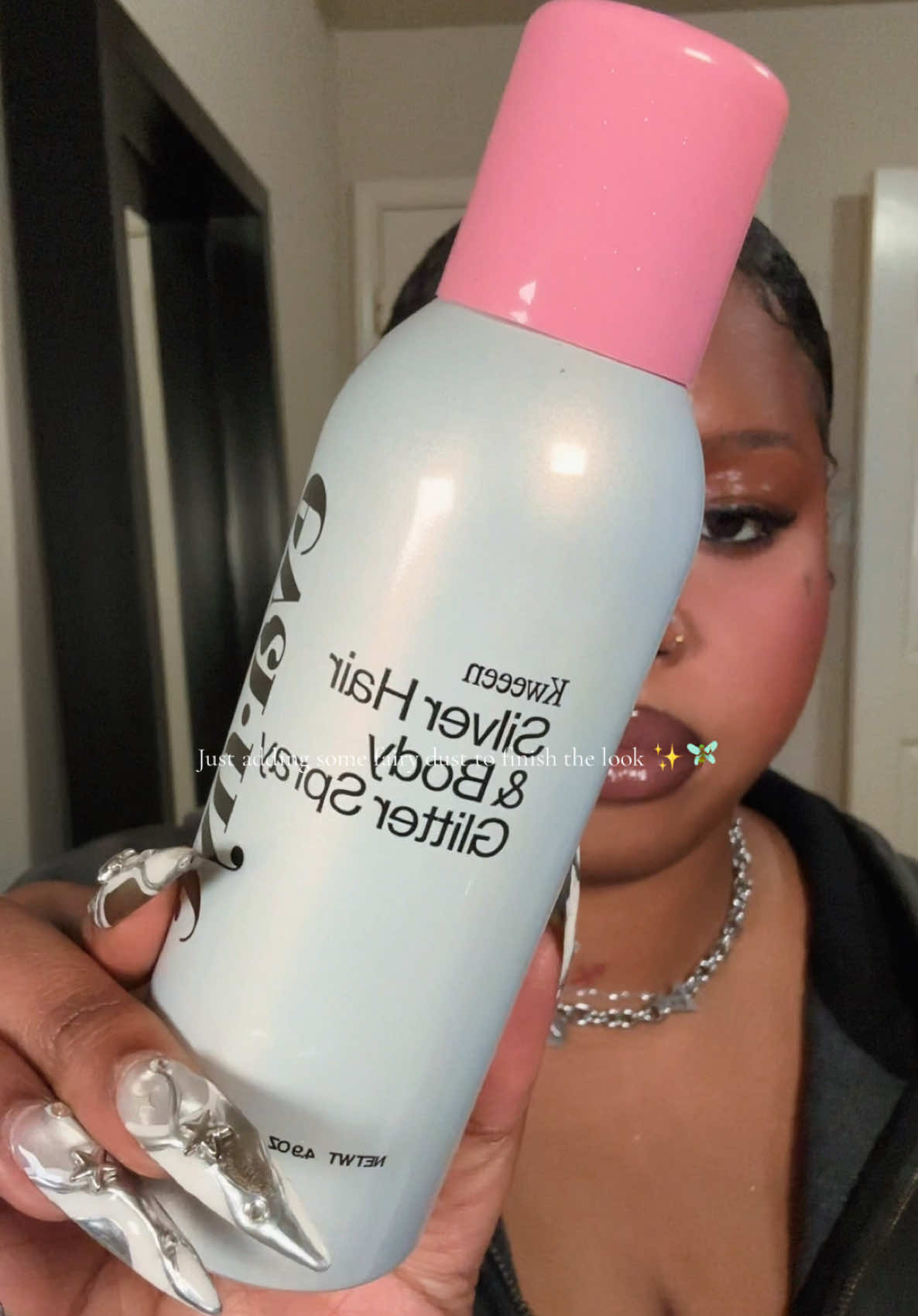 TikTok post by @izefeno for Eva NYC. Caption reads: @Eva NYC this glitter spray is my new personality....