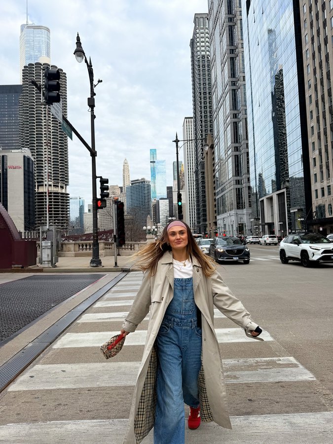 Instagram post by @misha_grimes for Choose Chicago. Caption reads: Chi- town 🤪🏀🤟🏼🧡✨ Okay first 24hrs in Chicago....