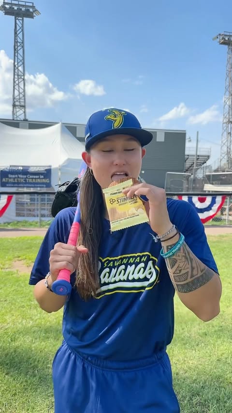 Instagram post by @kelsie_whitmore for Honey Stinger. Caption reads: @honeystinger keeps me fueled from the first pitch....