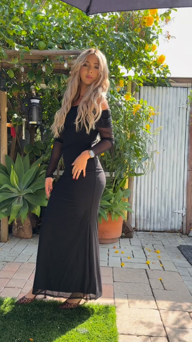 Instagram post by @ohheyitsevee for Reoria. Caption reads: Black and floor-length for the win.....