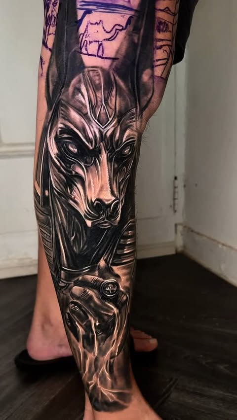 Instagram post by @kennethalchemytattoo for EMALLA Official. Caption reads: #anubis #sponsored by @t2tattooequipment....