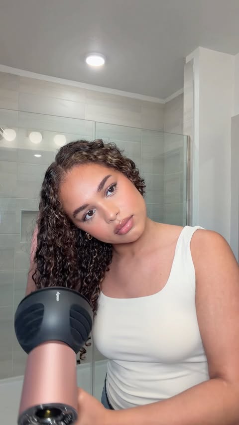 Instagram post by @mariahlovelewis for Briogeo. Caption reads: lightweight fresh curls with @briogeo ‘s new Don’t....