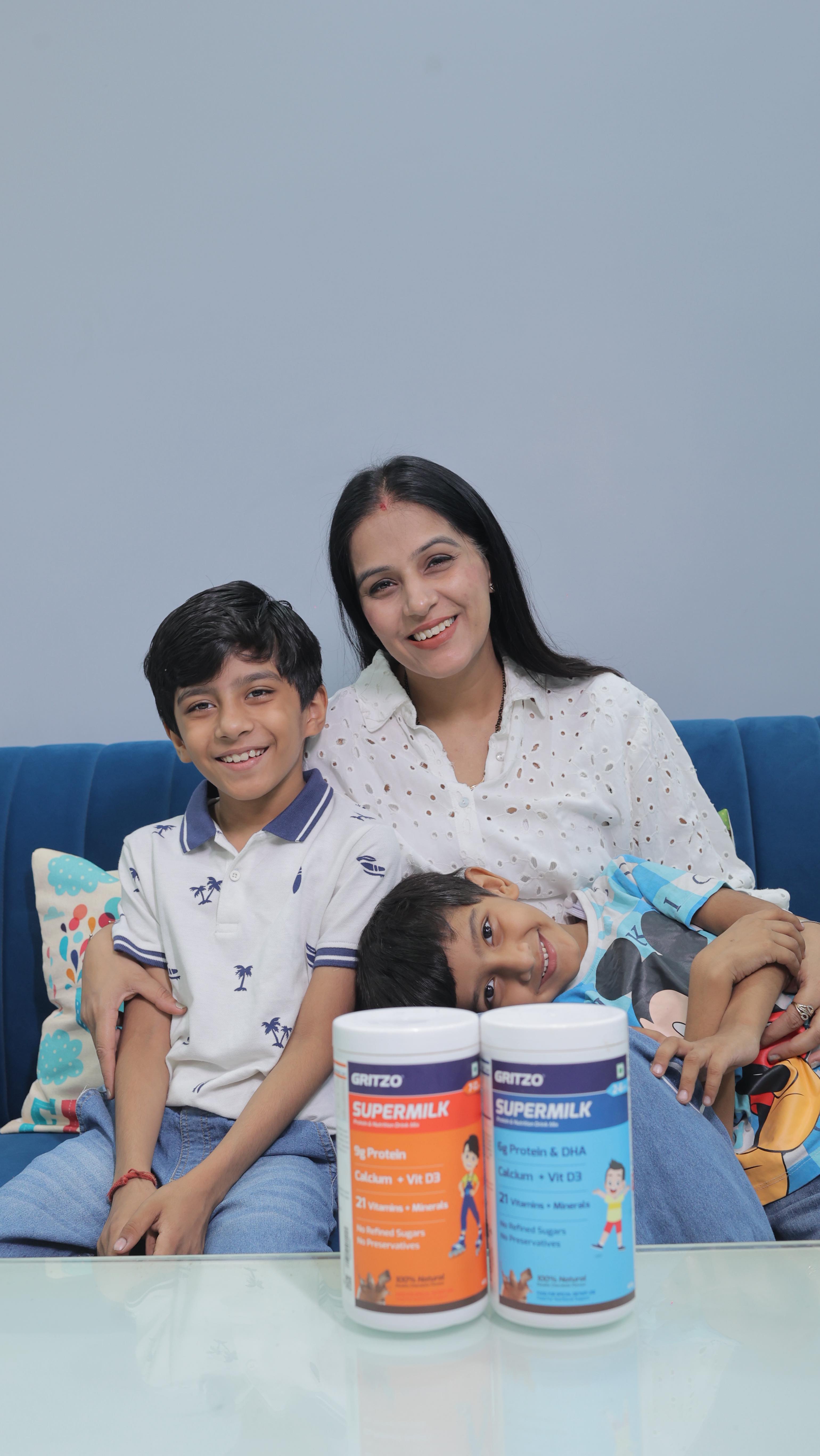 Instagram post by @maaof2sons for GRITZO. Caption reads: From cuddles to school hustle, I make sure my kids....