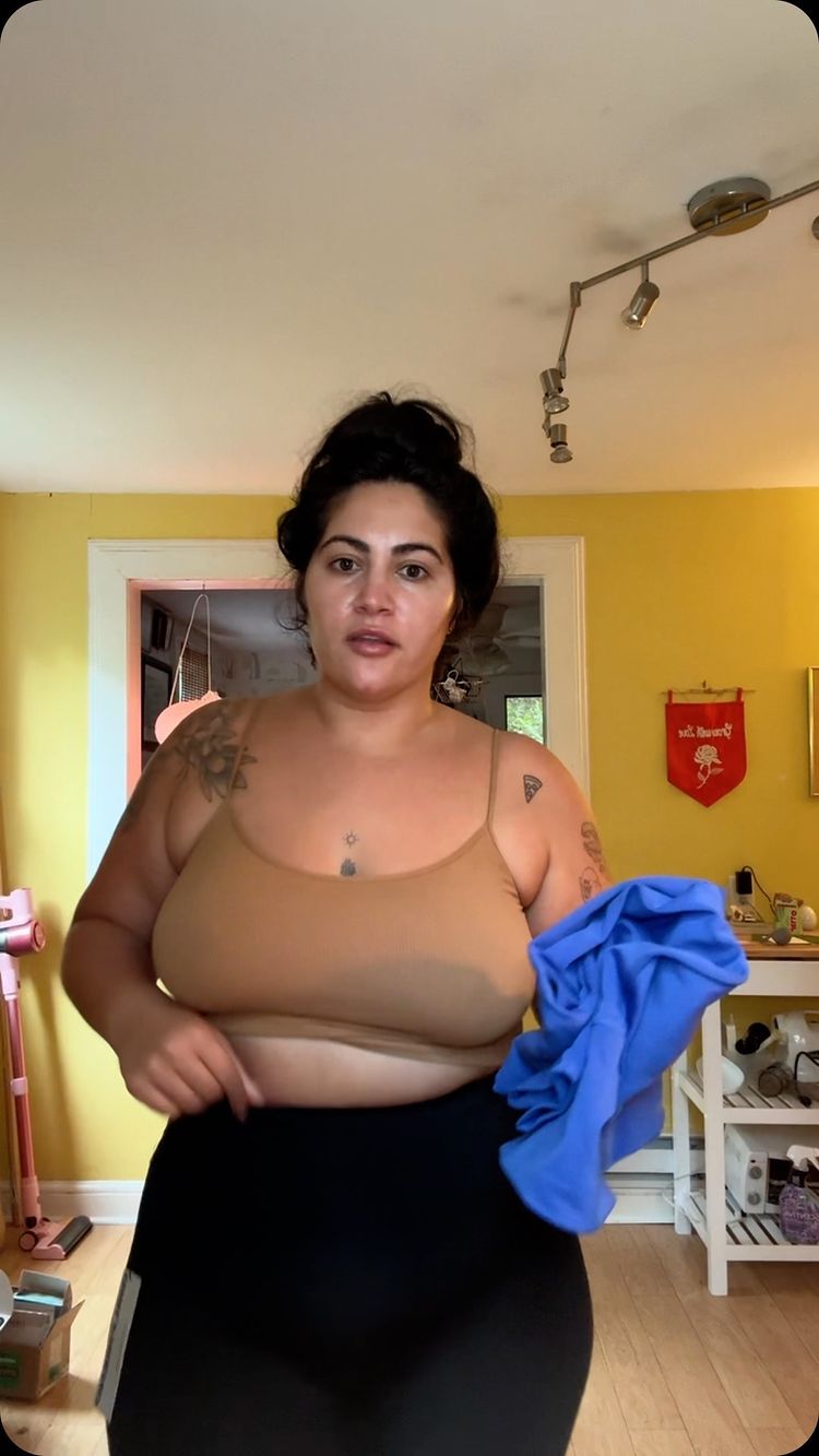 Instagram post by @reynisima for Girlfriend Collective. Caption reads: @girlfriend , what happened? As someone who has....