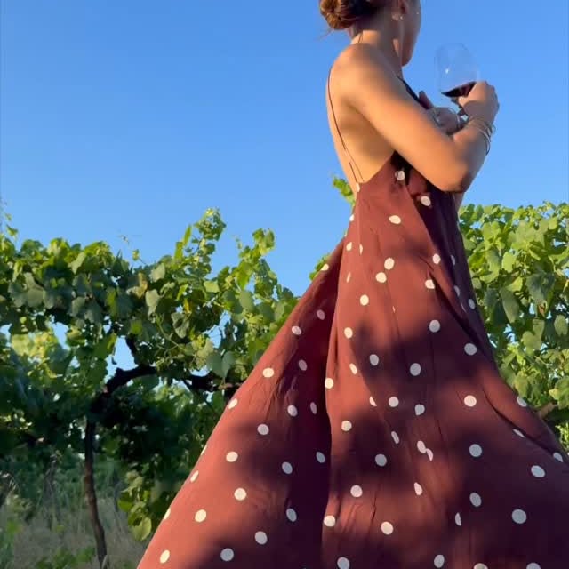 Instagram post by @hannahmeloche for Sezane. Caption reads: A summer afternoon in Italy wearing my @sezane....