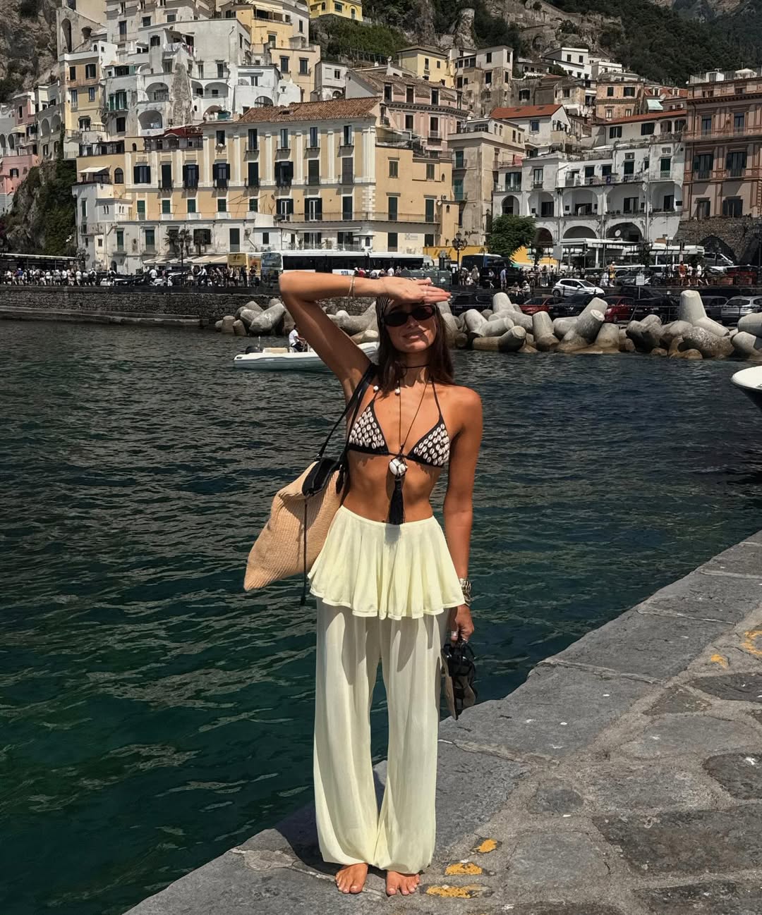 Instagram post by @weworewhat for Jimmy Choo. Caption reads: Ciao, Choo! 🇮🇹🍝🍹🚤🗺️🍕@jimmychoo 

#ad.
