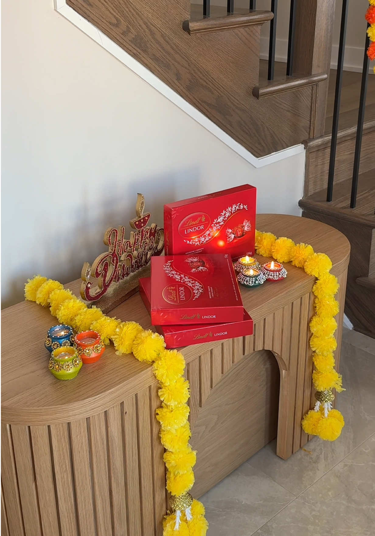 TikTok post by @dhivya.srii for Lindt. Caption reads: Celebrating Diwali this year with the sweetest....