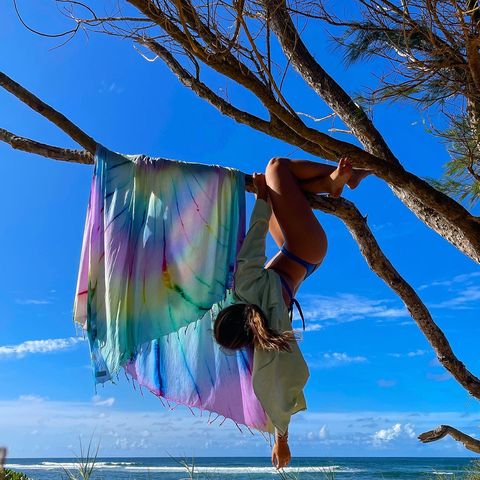 Instagram post by @lexxhidalgo for Sand Cloud. Caption reads: Hanging to dry with my favourite beach towel from....