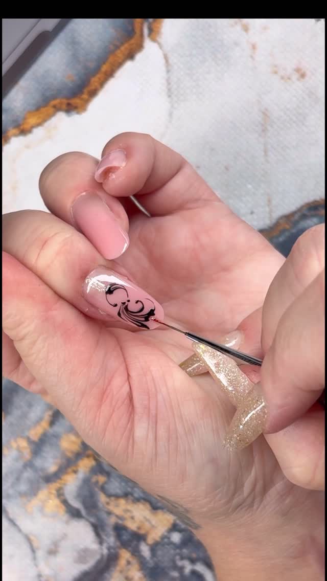 Instagram post by @nailsby_beppiebasant for Madam Glam. Caption reads: Timeless Red Nails with a Baroque Twist 👑 Nail....