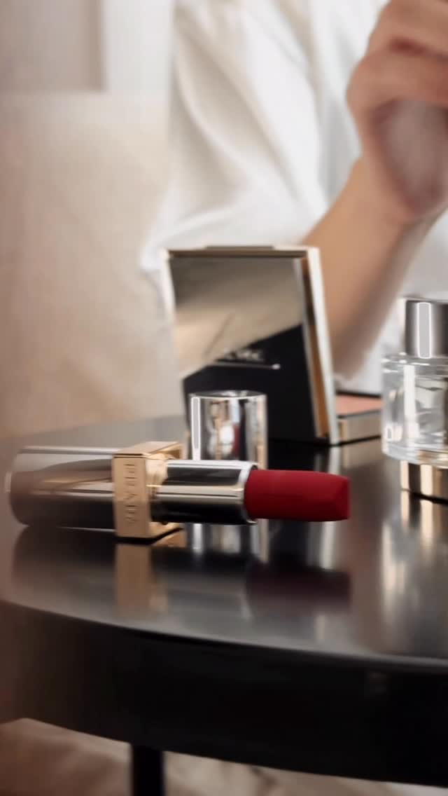 Instagram post by @darya_sizina for Prada Beauty. Caption reads: Prada touch-up moment 💋

@pradabeauty....