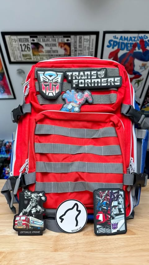 Instagram post by @toy_command for Wolfpak. Caption reads: Wolfpak Optimus Prime 35L Backpack! [...].
