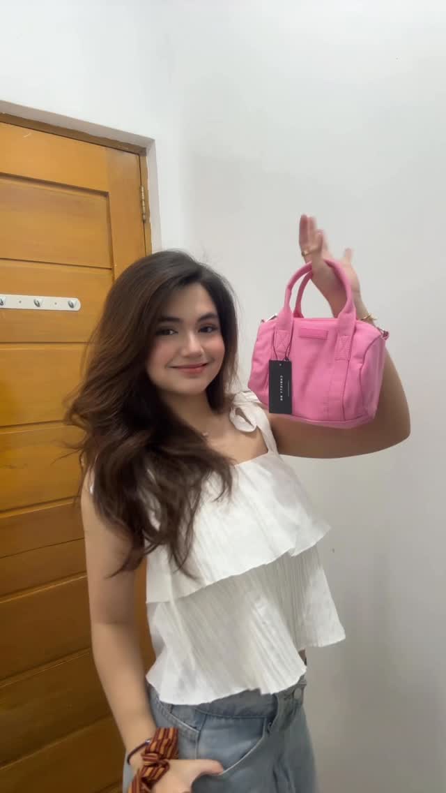 Instagram post by @allyson.mcbride_ for Christy Ng. Caption reads: Unbox and style my @christyng.ph bag with me 🌸💕.