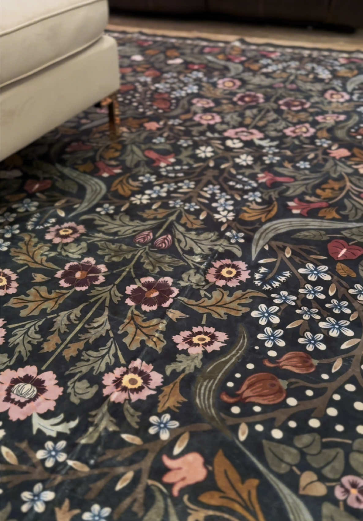 TikTok post by @saraanne86 for LA Home Decor. Caption reads: A moody rug moment 🖤 washable, cozy & absolutely....