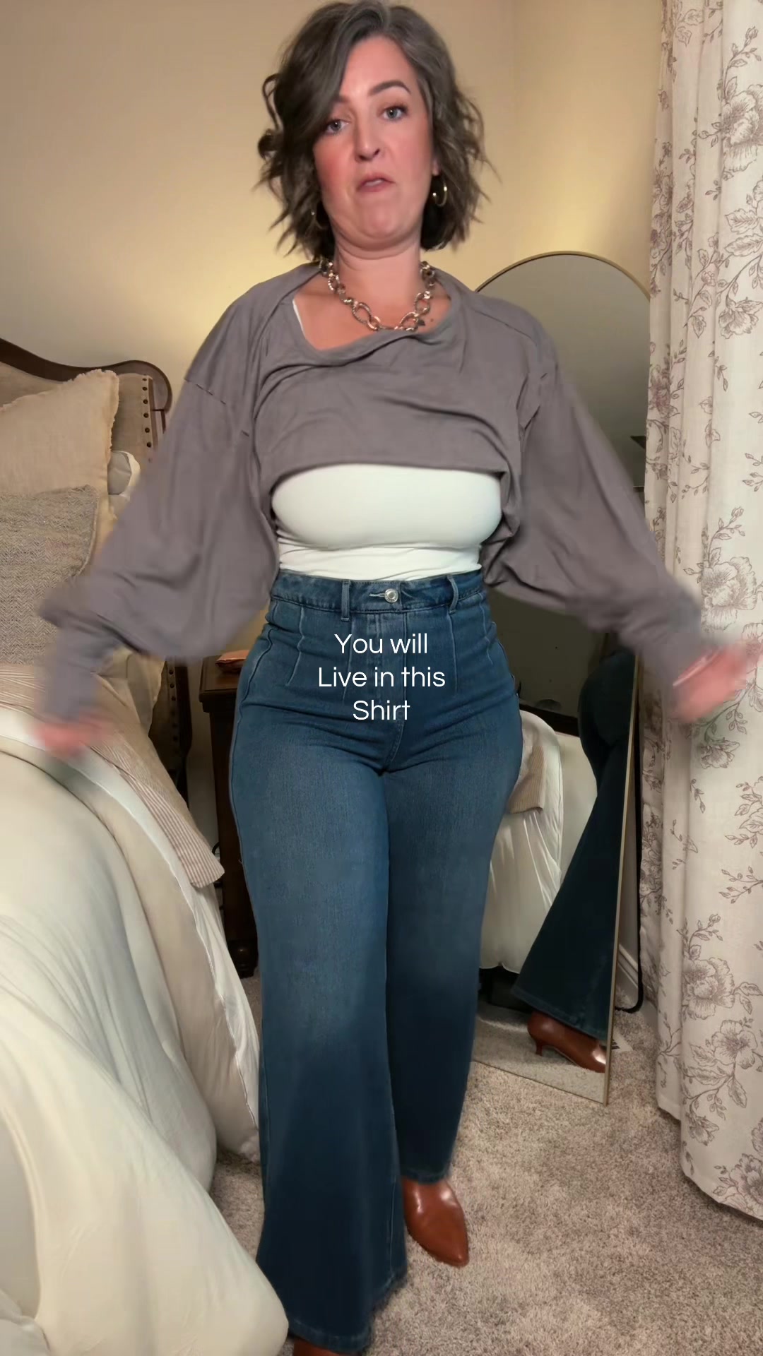 TikTok post by @mrs.erinjeanne for Fisace Shop. Caption reads: Oversized bellowing sleeve off the shoulder top....