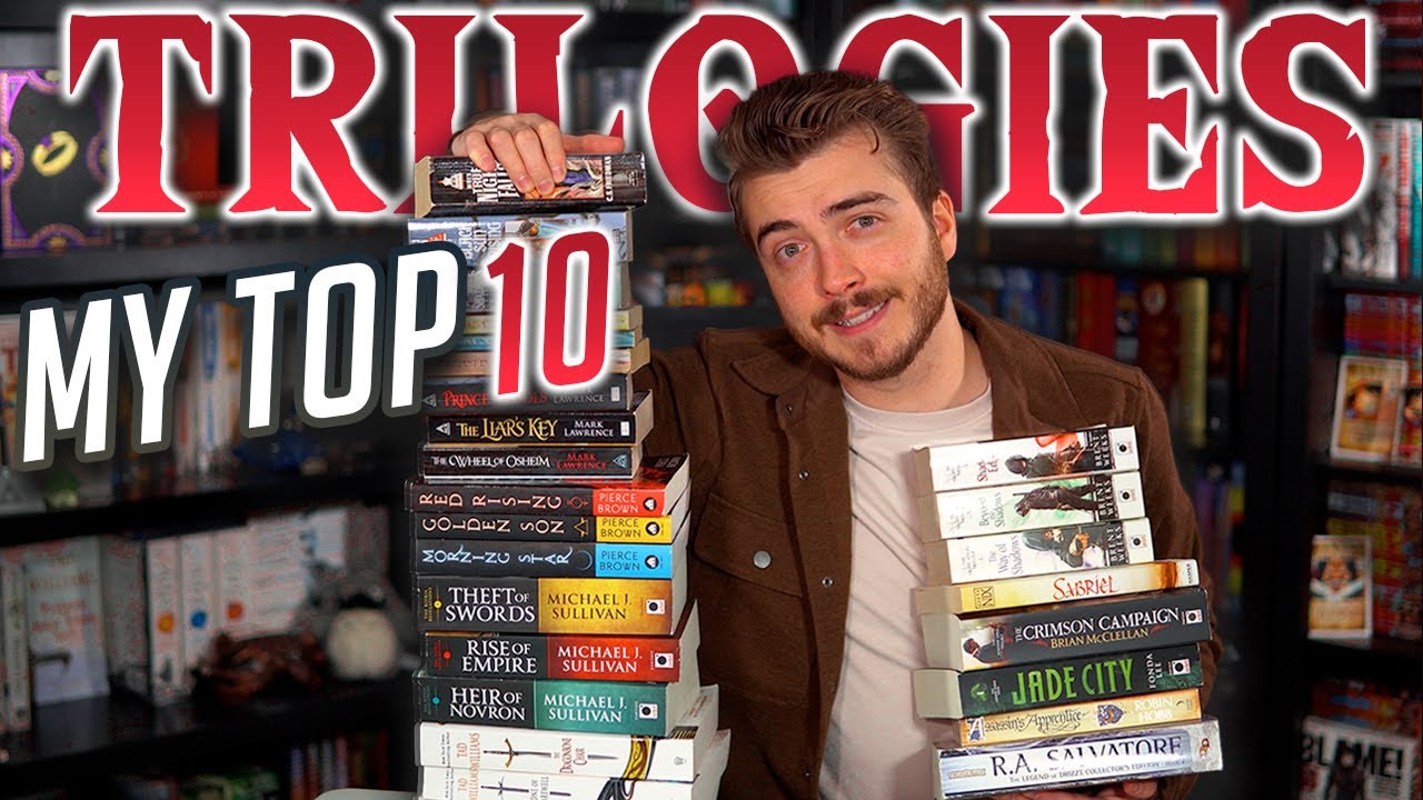 YouTube post by @CapturedInWords for INTO THE AM. Caption reads: My Top 10 Fantasy Trilogies (as of 2025).