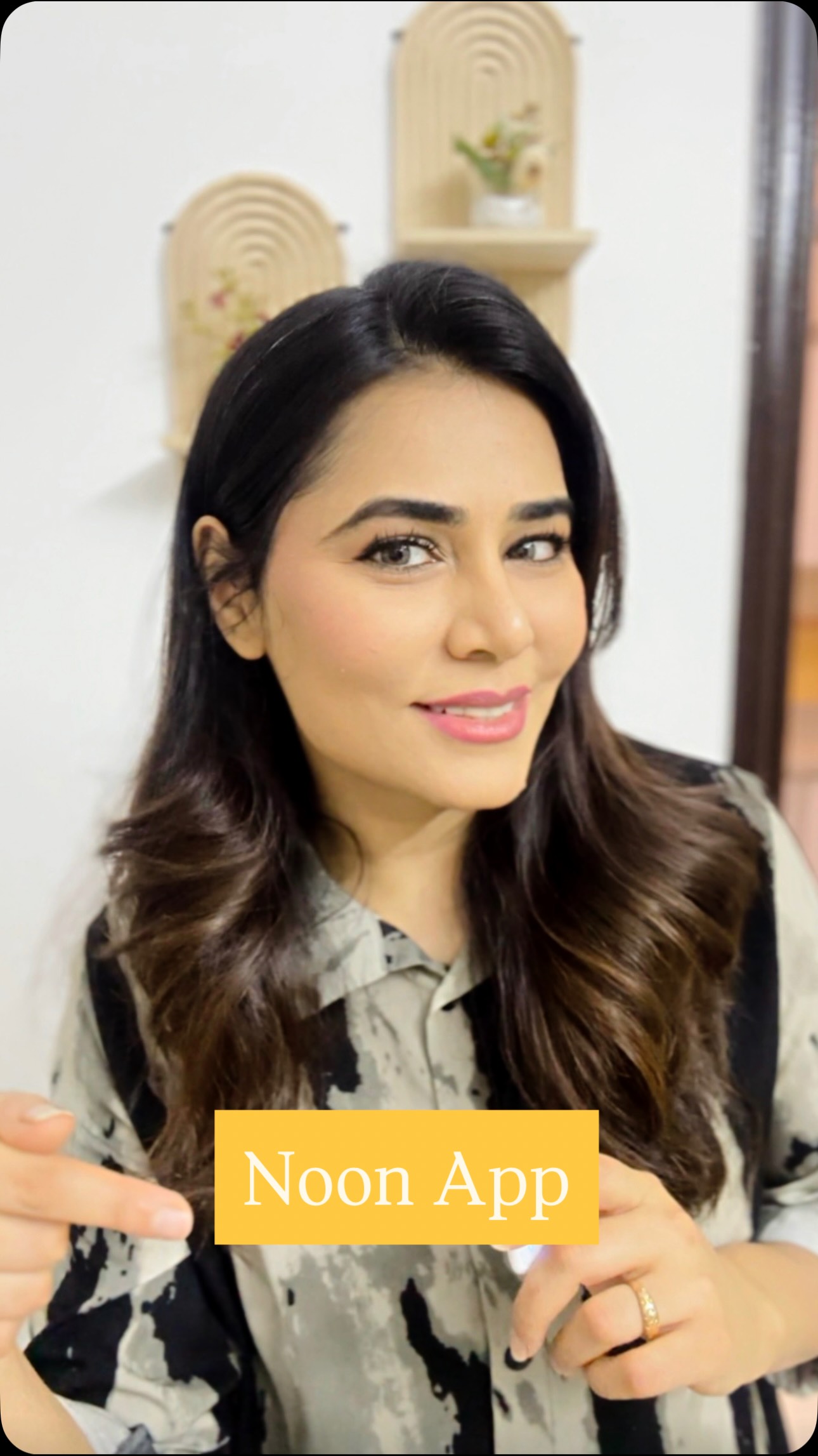 Instagram post by @sundusism for Noon. Caption reads: لا تفوتي أي عرض، كل منتجاتك الأصلية متوفرة على....