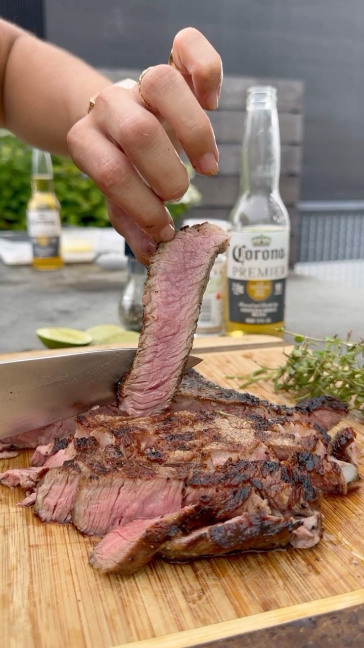 Instagram post by @lamb_chop97 for Corona USA. Caption reads: perfect pair 🥩🍺 steak and corona premier....