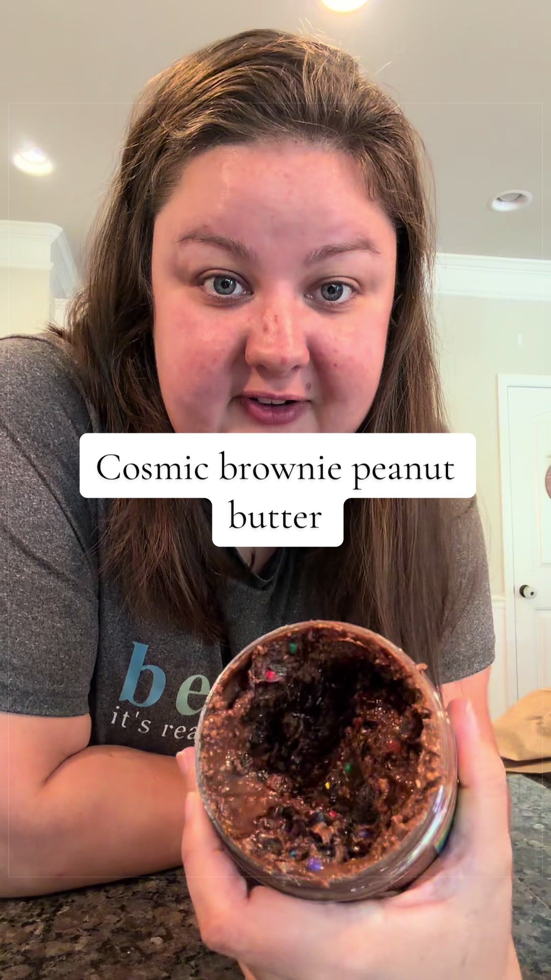 TikTok post by @olivia.m.dobson for Nerdy Nuts. Caption reads: This @Nerdy Nuts Shop cosmic brownie peanut butter....