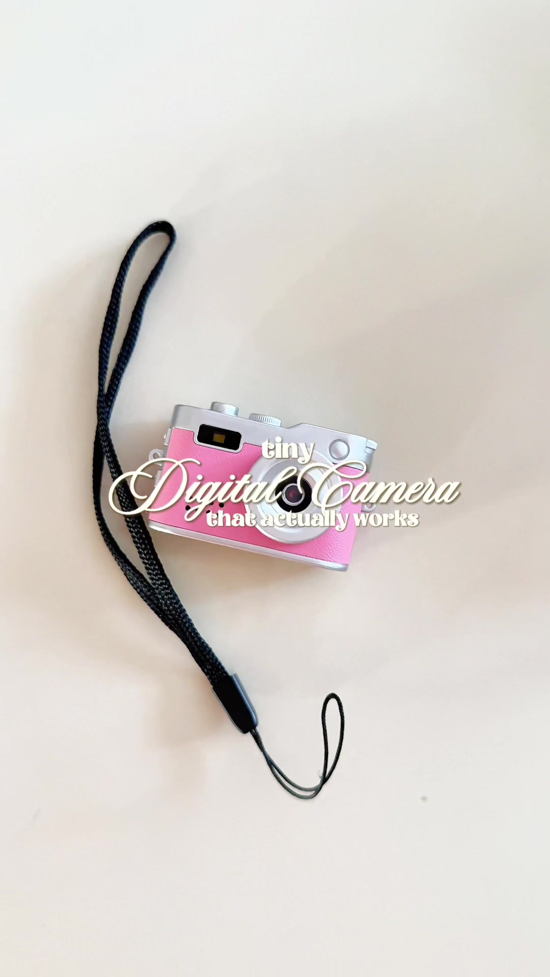 TikTok post by @strawberriezsnz for Fitpolo. Caption reads: mini digital keychain camera that actually works....