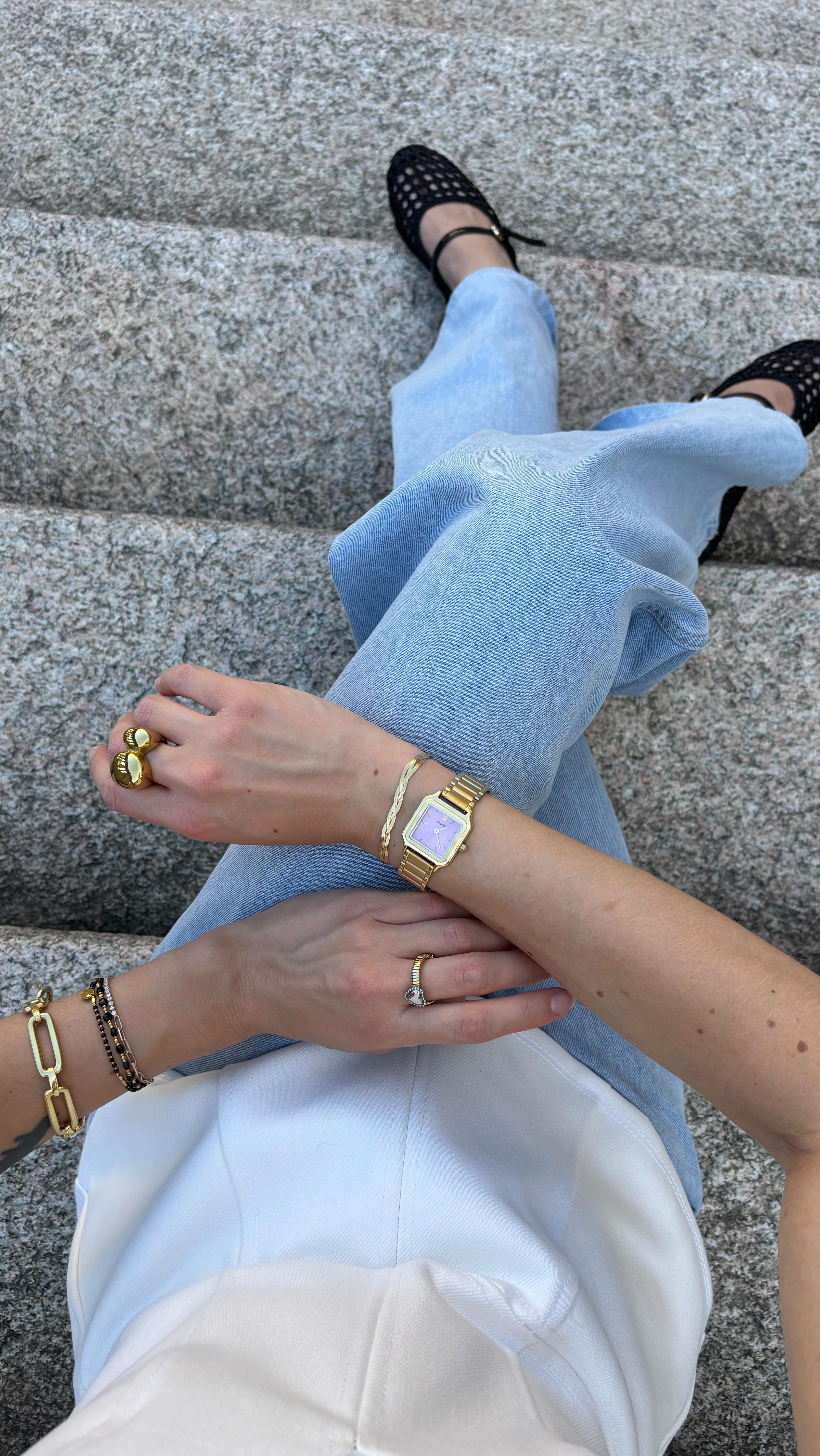 Instagram post by @giulia__fondati for CLUSE. Caption reads: wearing @cluse watch and bracelet 💛🌼
#cluse....