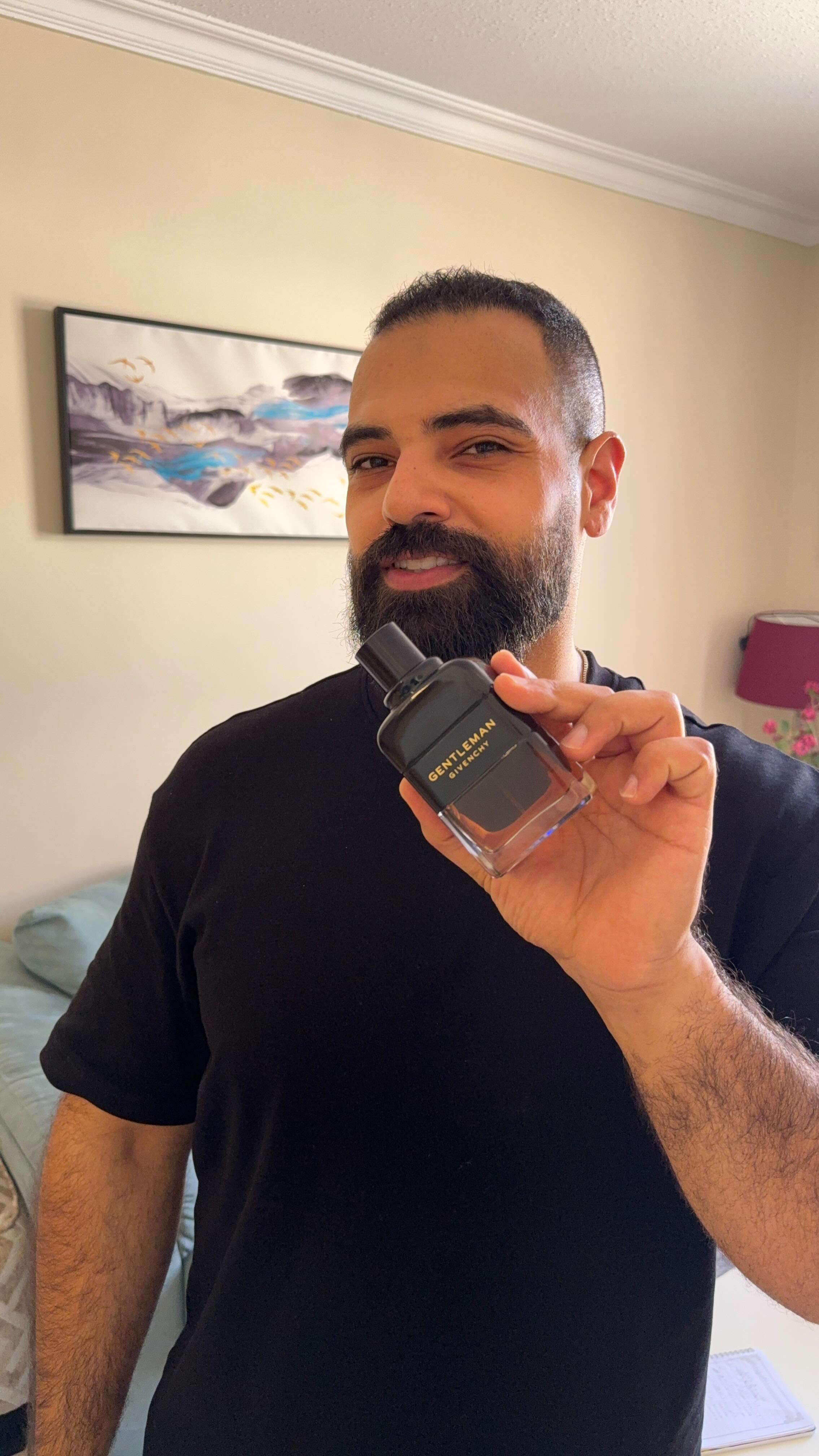 Instagram post by @kamalspwc for Givenchy Beauty. Caption reads: “It all begins with amber, captured like fire in a....