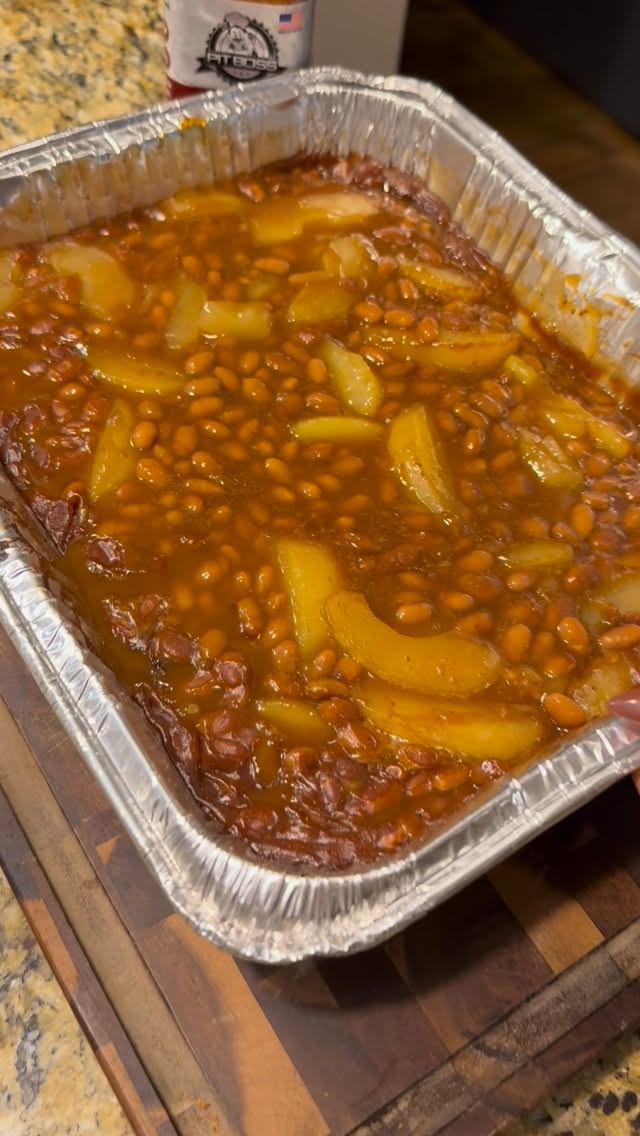 Instagram post by @richardeats_ for Pit Boss Grills. Caption reads: Smoked Apple Pie Baked Beans with the help of my....