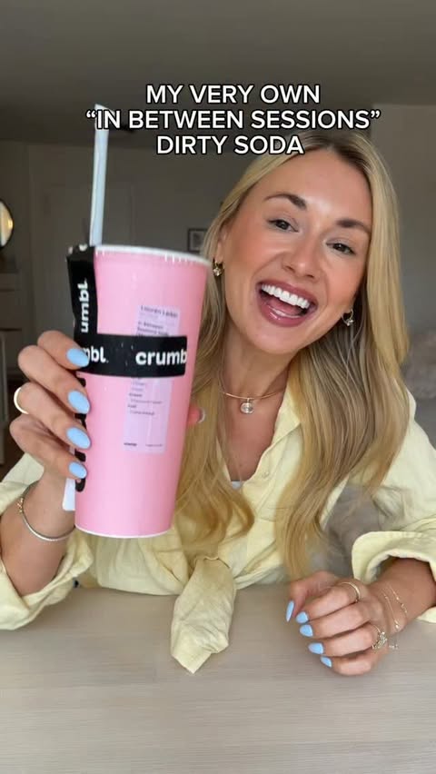 Instagram post by @itslaurenelarkin for Crumbl Cookies. Caption reads: The official “In Between Sessions” Dirty Soda is....