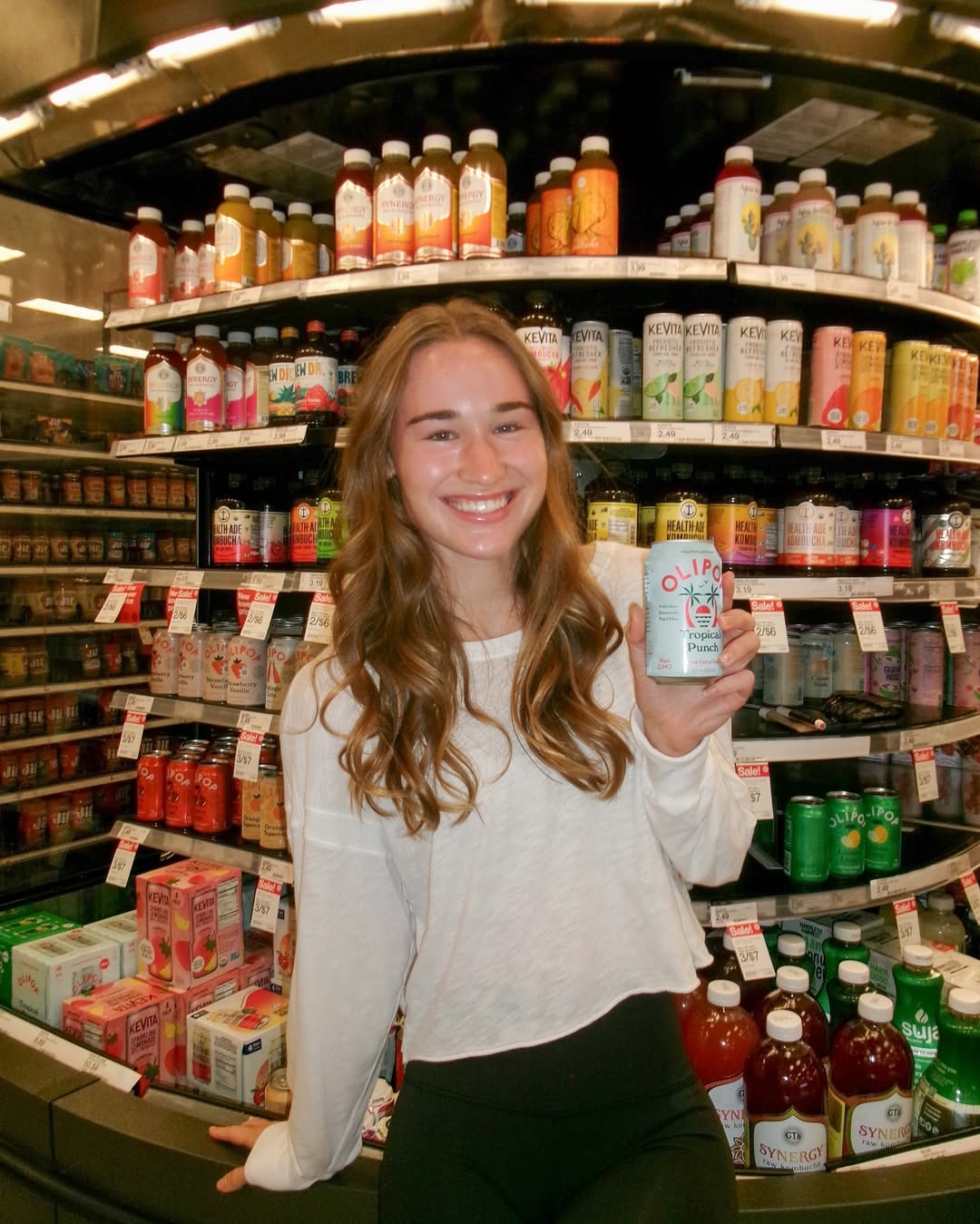Instagram post by @elliegeoffroy for 98Strong. Caption reads: SOOO excited to share that @drinkolipop is....