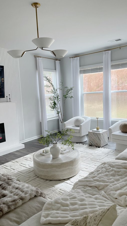 Instagram post by @jeanny.myneutralhome for Rowabi. Caption reads: The fractal pendant light from @rowabi.interiors....