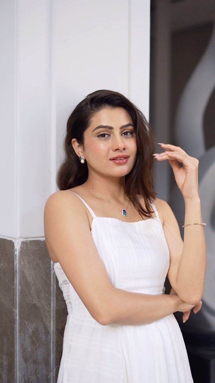 Instagram post by @dikshapawarofficial_ for CaratLane. Caption reads: # Ad Classic elegance in white, beautifully....