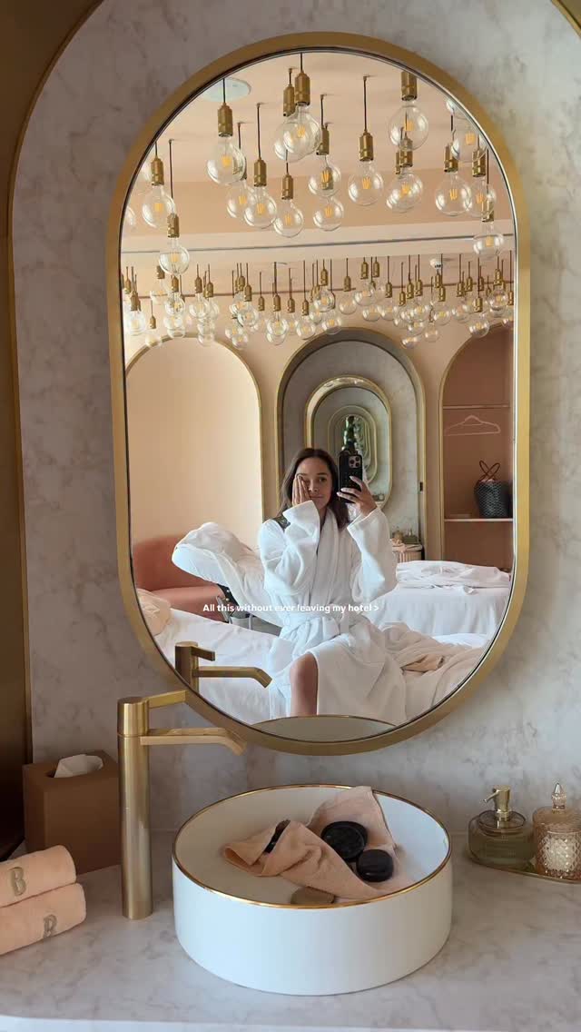 Instagram post by @julieanneho for Visit Dubai. Caption reads: Checked in, never leaving @wdubaiminaseyahi....